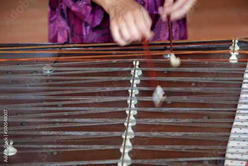 The cimbalom instrument played by a musician photo