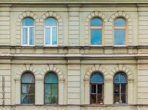 Several windows in a row on the facade of the urban historic apartment building front view, Saint Petersburg, Russia
 photo