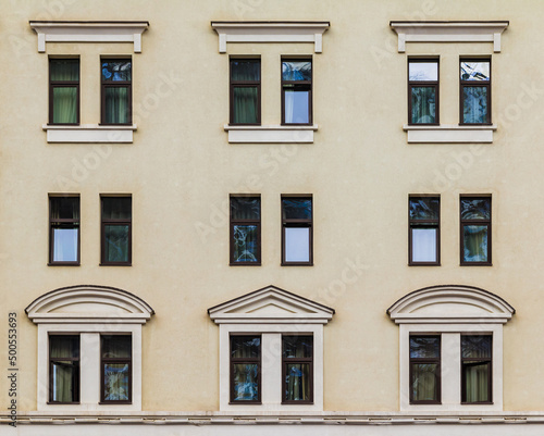 Many windows in a row on the facade of the modern urban apartment building front view, Krasnaya Polyana, Sochi, Krasnodar Krai, Russia 