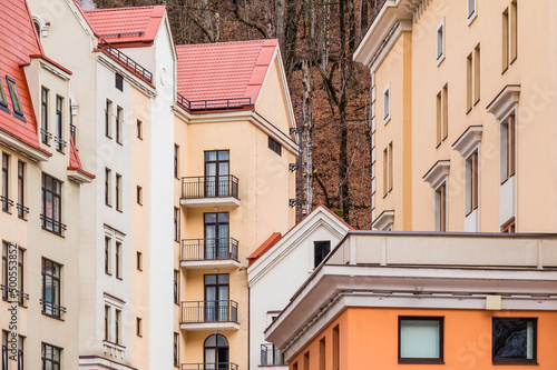 Group of parts of urban apartment buildings facades, Krasnaya Polyana, Sochi, Krasnodar Krai, Russia 