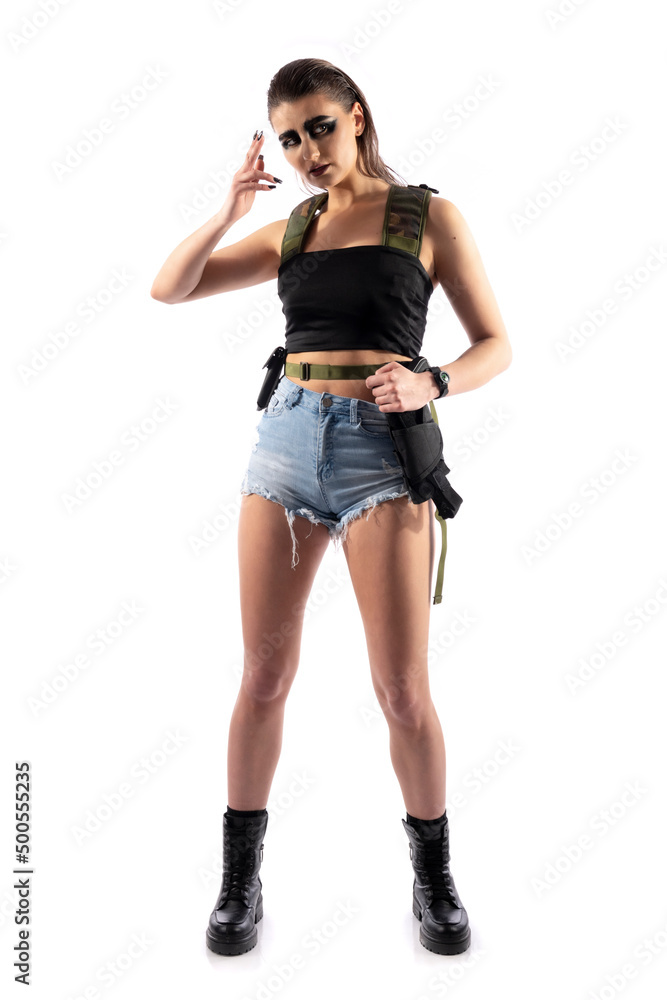 Dangerous female killer with a gun. Beautiful shapely woman. Specific makeup Dangerous female killer with a gun. Beautiful shapely woman. Specific makeup