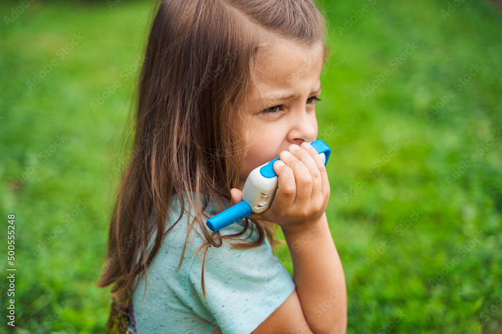 Small girl,kid play in walkie-talkie.Walkie Talkies with channels.Game of detectives, spies.Children talk,say messages at distance.Communication with parents in forest,park,hike.Finding lost people Small girl,kid play in walkie-talkie.Walkie Talkies with channels.Game of detectives, spies.Children talk,say messages at distance.Communication with parents in forest,park,hike.Finding lost people