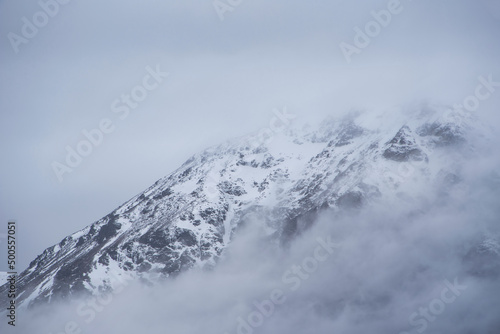 Beautiful Winter landscape image of snowcapped peak of Stob Dearg Buachaille Etive Mor in Glencoe, Rannoch Moor