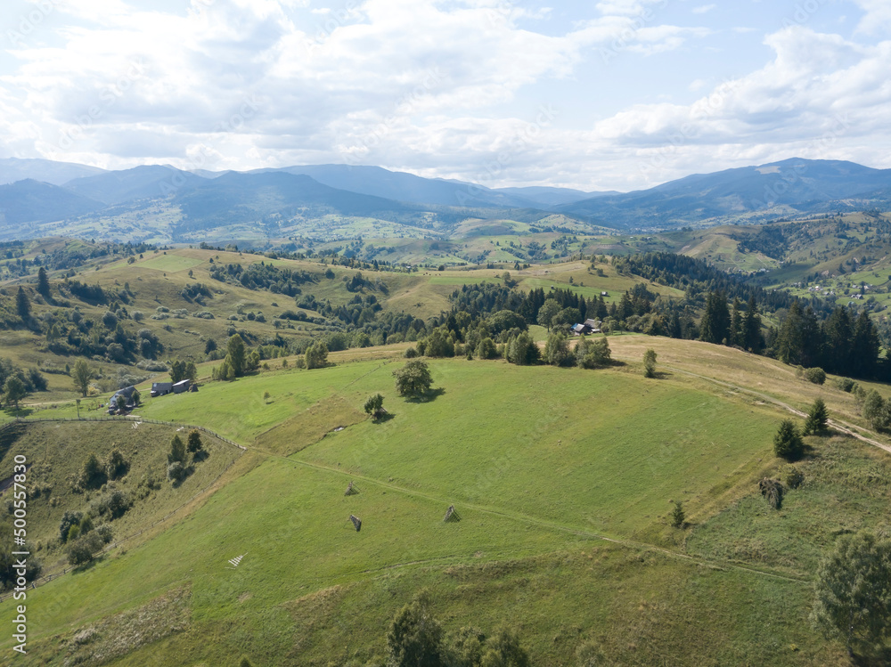 Green mountains of Ukrainian Carpathians in summer. Coniferous trees on the slopes. Aerial drone view. Green mountains of Ukrainian Carpathians in summer. Coniferous trees on the slopes. Aerial drone view.