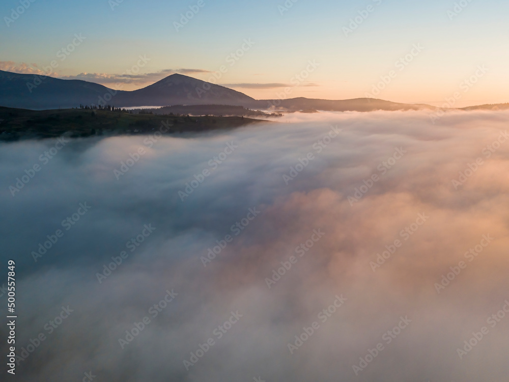 Morning fog in the Ukrainian Carpathians. Aerial drone view.