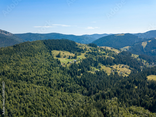 Green mountains of Ukrainian Carpathians in summer. Sunny clear day. Aerial drone view.