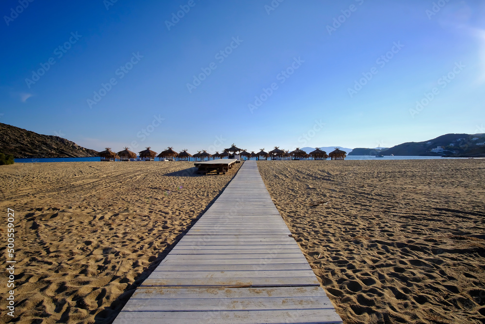 A wooden path leading to the famous sandy beach of Mylopotas in Ios