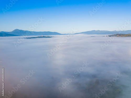 Morning fog in the Ukrainian Carpathians. Aerial drone view.