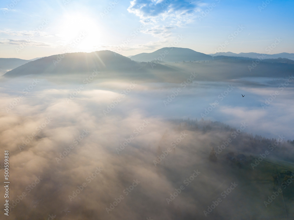 Sunrise over the fog in the Ukrainian Carpathians. Aerial drone view. Sunrise over the fog in the Ukrainian Carpathians. Aerial drone view.