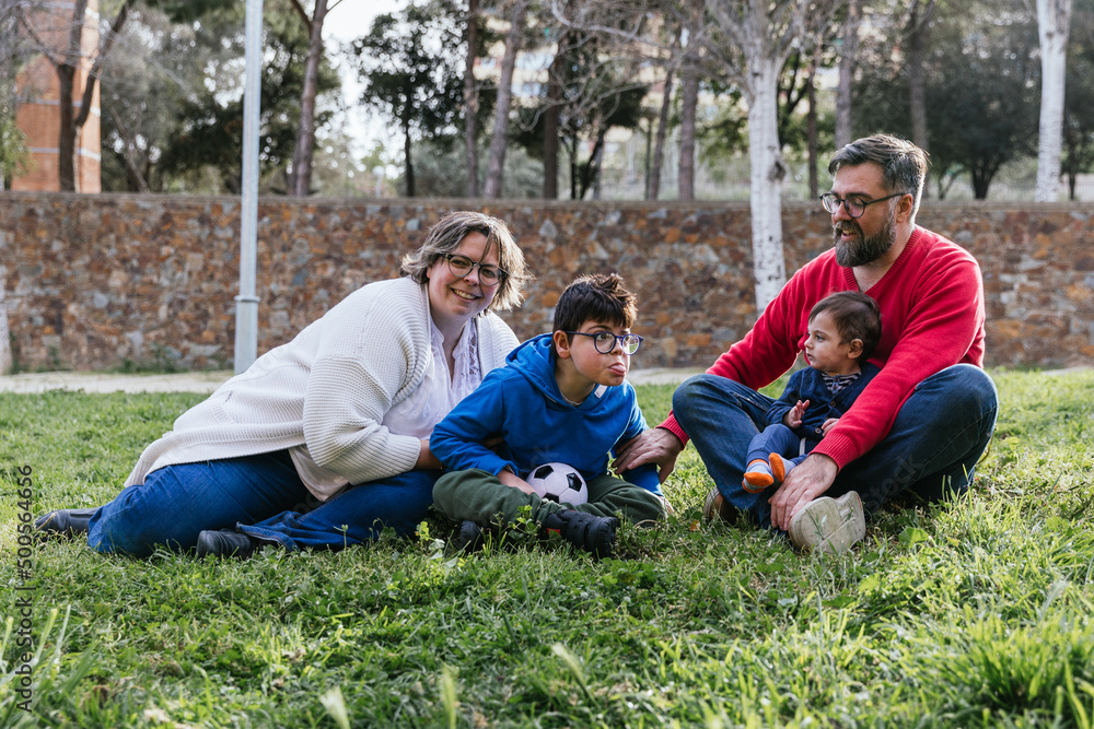 Portrait of a happy family enjoying a day outdoors in the park. Portrait of a happy family enjoying a day outdoors in the park.
