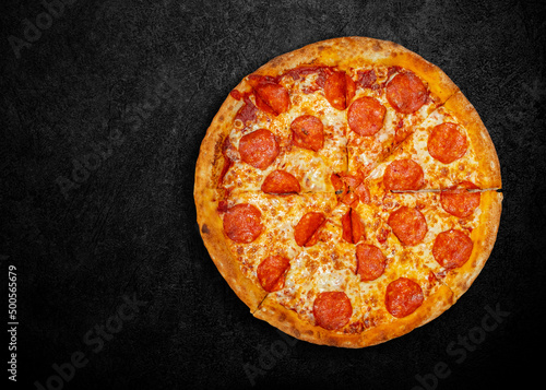 Delicious fresh pizza on dark background