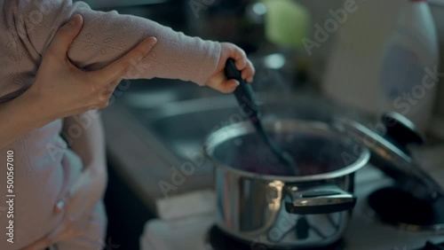Wallpaper Mural Cinematic authentic shot of happy mother and her little toddler baby boy son are having fun to make dough with flour together for baking cookies or bread in kitchen at home. Torontodigital.ca