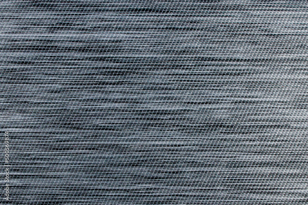 Gray fabric background from textile dense material with wicker pattern, close up. Fabric structure. Fabric background Gray fabric background from textile dense material with wicker pattern, close up. Fabric structure. Fabric background