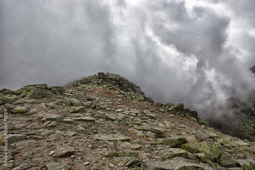 A break in the cloud gives a view of the Summit of El Morezón in the Circo de Gredos in the Avila region.