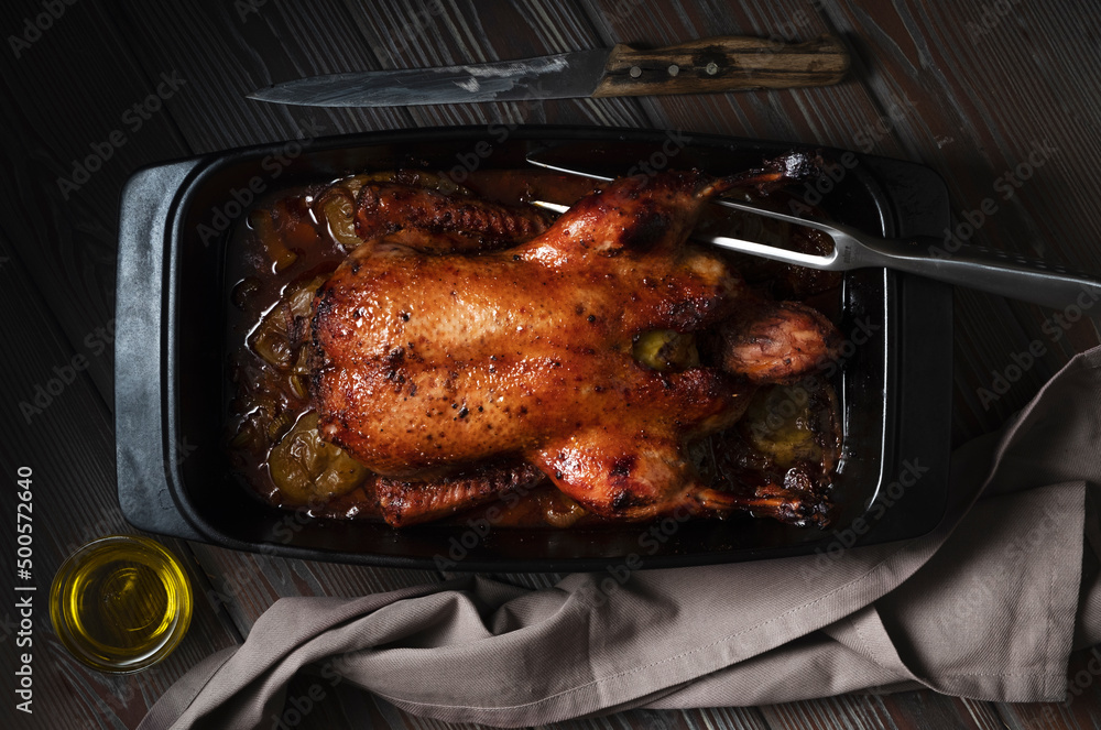 Duck baked in beer with vegetables in casserole Duck baked in beer with vegetables in casserole