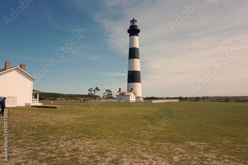 Body Island Lighthouse with Part of Lighthouse Keeper White House in Sunlight