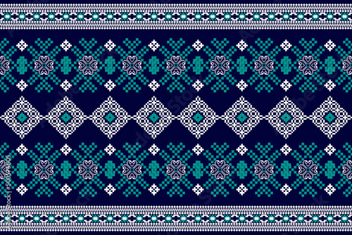 Beautiful Native cross stitch pattern on blue background.Aztec style embroidery abstract vector illustration.white oriental with green leaf.design for texture,fabric,clothing,wrapping,carpet,print. photo