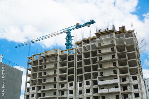 The architectural complex of residential buildings on sky background