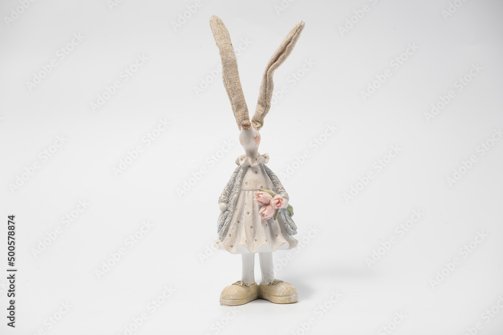White Easter bunny rabbit with shopping basket and painted eggs on blue and pink background White Easter bunny rabbit with shopping basket and painted eggs on blue and pink background