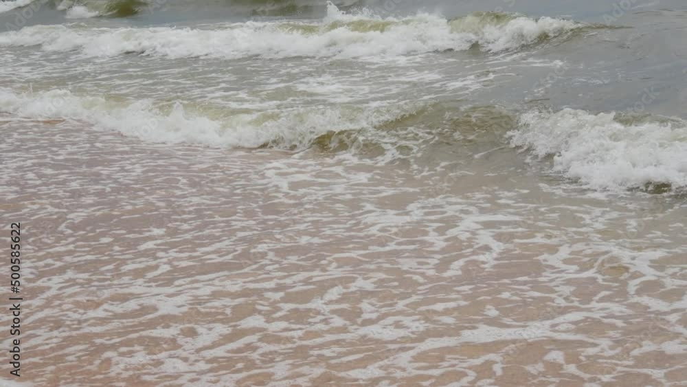 Strong waves with foam on the shore of the Sea of Azov, Ukraine Strong waves with foam on the shore of the Sea of Azov, Ukraine
