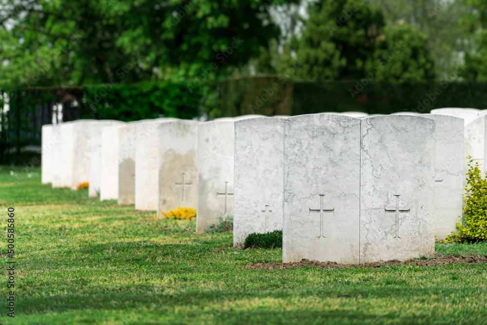 Rows of white tombstones at the military memorial cemetery. Rows of white tombstones at the military memorial cemetery.