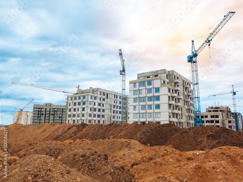 The architectural complex of residential buildings on sky background