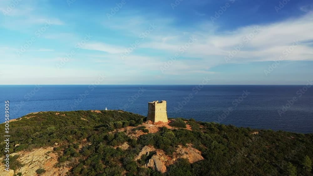 The turquoise seaside and the green countryside, in Europe, in France, in Corsica, towards Calvi, by the Mediterranean Sea, in summer, on a sunny day. The turquoise seaside and the green countryside, in Europe, in France, in Corsica, towards Calvi, by the Mediterranean Sea, in summer, on a sunny day.