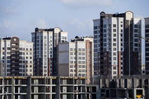 The architectural complex of residential buildings on sky background