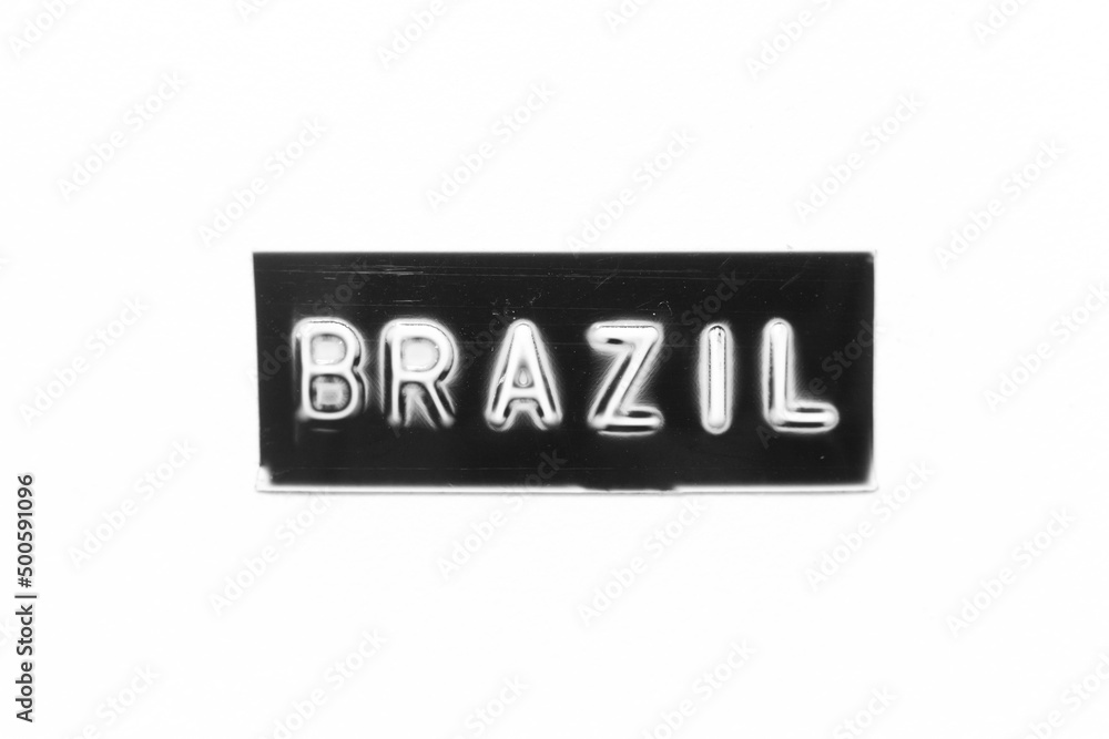Black color banner that have embossed letter with word brazil on white paper background Black color banner that have embossed letter with word brazil on white paper background