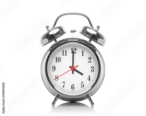 Alarm clock isolated on white background. Four hours after midnight or noon. Sixteen hours on the clock.