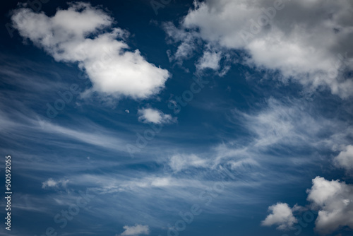 Fototapeta Naklejka Na Ścianę i Meble -  Moon hiding in the clouds with blue sky