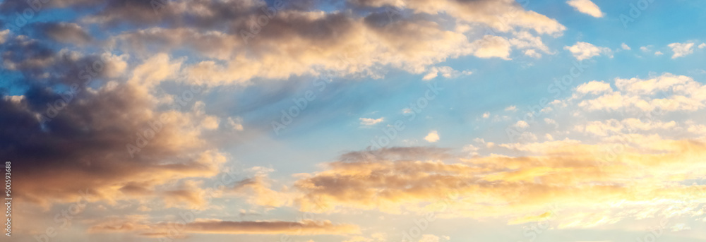 Picturesque sky with fluffy clouds at sunset, panorama