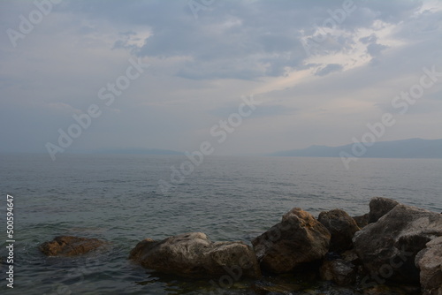 View of the sea with sunset and rocks © Alex Jauk