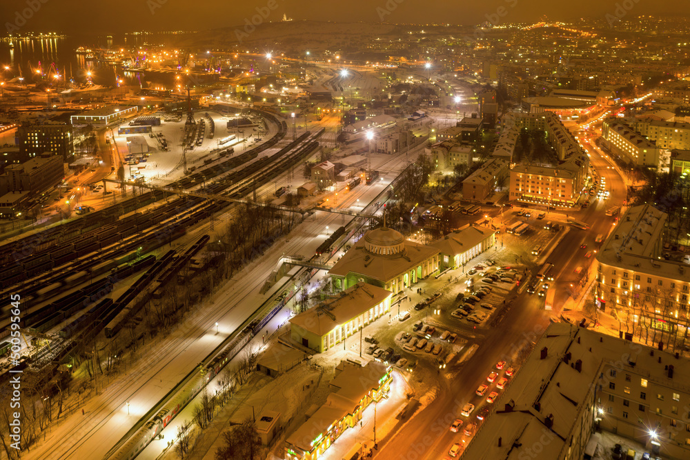 Aerial view of the town and Main railway station on polar night. Murmansk, Russia.