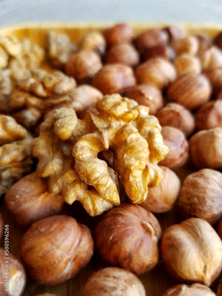 Walnuts and hazelnuts on a plate Walnuts and hazelnuts on a plate