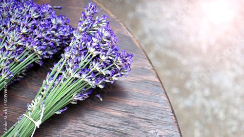 Fototapeta Naklejka Na Ścianę i Meble -  Lavender bouquet on wood table top view angle at Furano Hokkaido Japan which flowers are full bloom and have a great fragrance of aroma for relaxing moment.