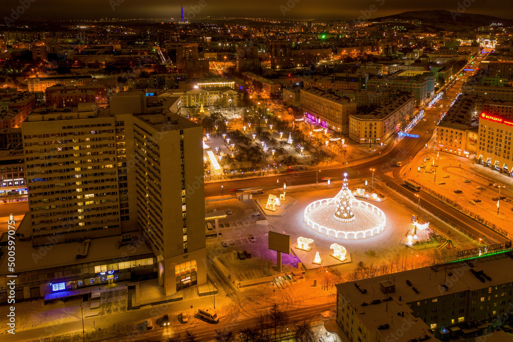 Aerial view of the town and Five Corners squqre on polar night. Murmansk, Russia.