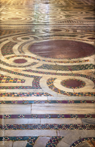 ROME, ITALY - AUGUST 29, 2021: Detail of old mosaic floor from church Basilica di San Crisogono in Trastevere