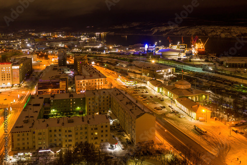 Aerial view of the town  railway station and sea port on polar night. Murmansk  Russia.