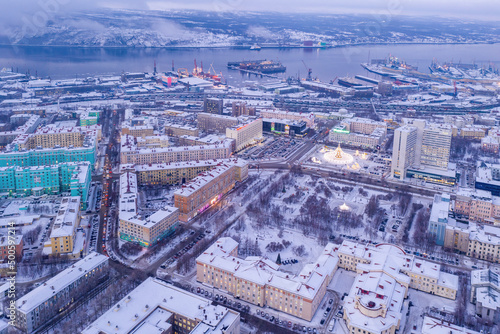 Aerial view of centre of the town and Kola bay on winter day. Murmansk, Russia.
