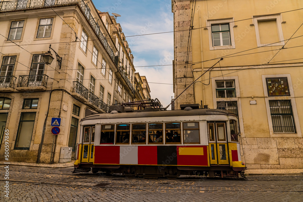 A view of typical street traffic in the Bairro Alto distict in the city of Lisbon on a spring day