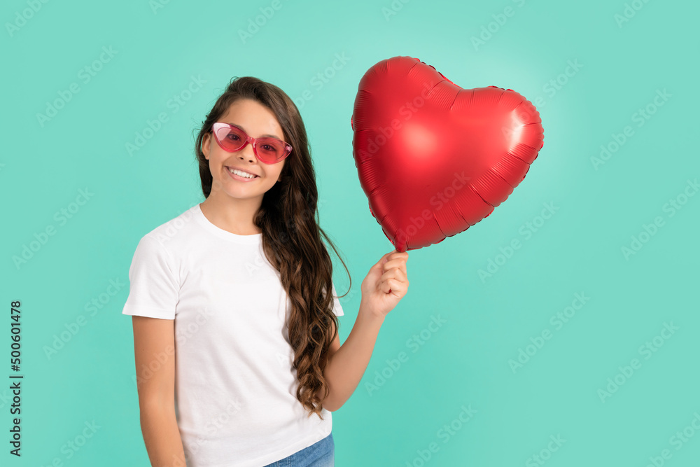 happy kid in sunglasses hold red heart party balloon for valentines day love symbol, sweetheart happy kid in sunglasses hold red heart party balloon for valentines day love symbol, sweetheart