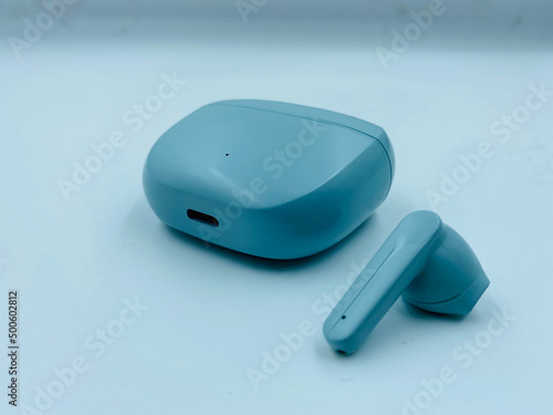 earbud and casing blue in colour for music enthusiast photo