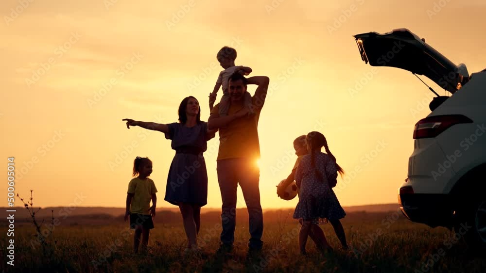 Happy family travel by car People are having fun on vacation at sunset