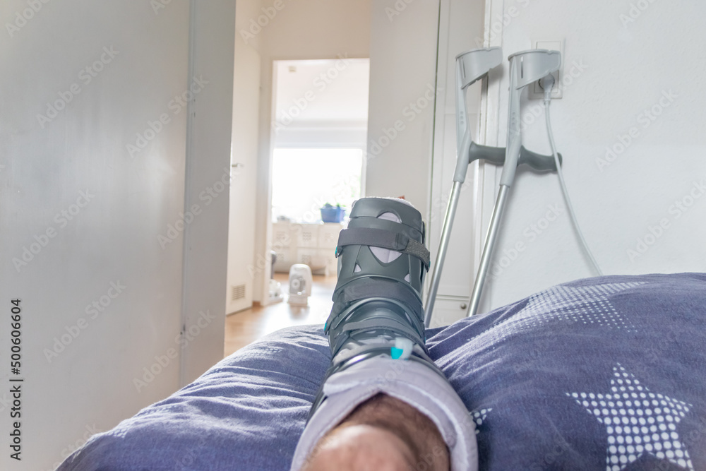 European man after Achilles tendon rupture operation is back home with