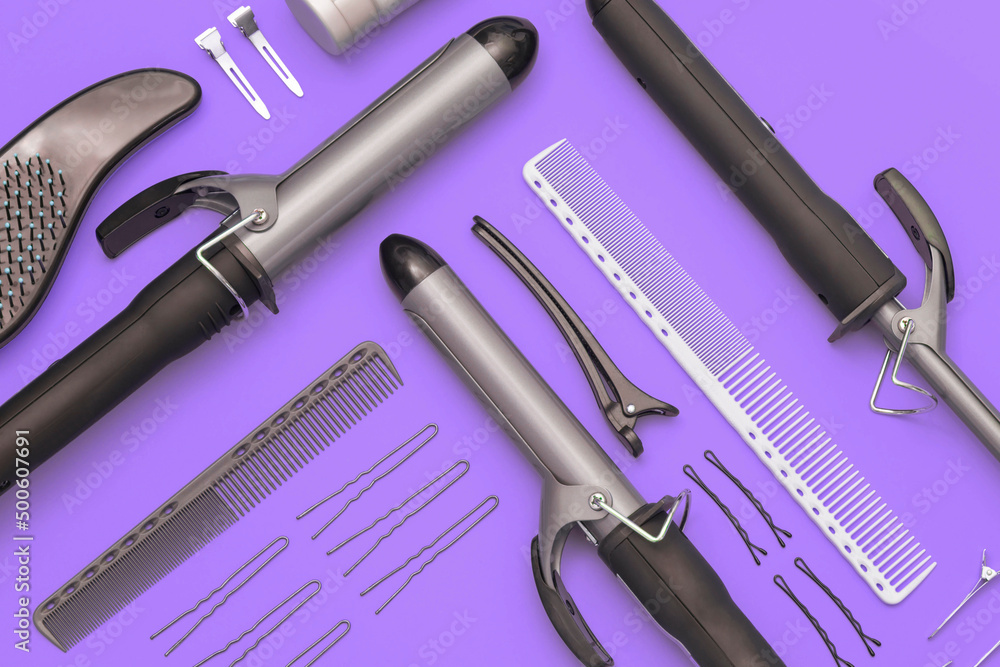  Сomposition with professional hairdresser tools on purple background. Flatlay.