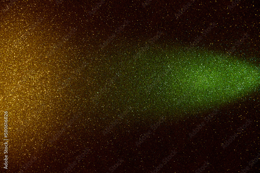 On a golden gradient background in fine grain, a green wide beam of light