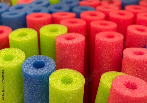 Canvas Print Many colorful pool noodles close up shot , selective focus.