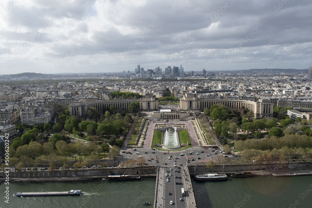 Paris, France, 05-04-2022: aerial view of the city skyline with the river Seine, the Trocadéro Gardens and the skyscrapers of the La Defense district seen from the top of the Eiffel Tower