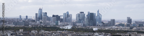 Paris, France, Europe: aerial view of the city skyline with the skyscrapers of the La Defense, a business district with offices, condos and shopping centers, seen from the top of the Eiffel Tower